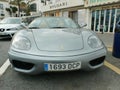 Front view of a gray Ferrari 360 spider parked in Spain