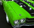 Front view of a great green retro american muscle car Chevrolet Camaro SS. Car exterior details. Royalty Free Stock Photo