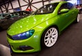 Front view of green car Wolkswagen with sport tuning