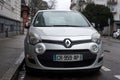 Front view of grey Renault twingo 3 parked in the street by rainy day Royalty Free Stock Photo