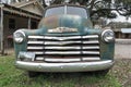 Front view and grill of a rusty retro Chevy truck