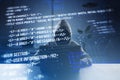 Front view of hacker using computers at desk with creative digital programming language on blurry background. Software developer, Royalty Free Stock Photo