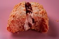 Front view of half eaten strawberry flavor bread Royalty Free Stock Photo