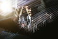 Handsome african elegant serious man drives a car Royalty Free Stock Photo