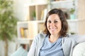 Happy adult woman posing looking camera at home