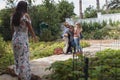 Father embracing his children while mother looking them in garden Royalty Free Stock Photo