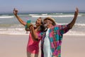 Senior couple taking selfie with mobile phone on beach Royalty Free Stock Photo