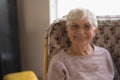 Front view of senior woman looking at camera in nursing home Royalty Free Stock Photo