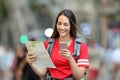 Teen tourist searching location online on the street