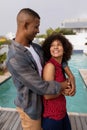 Couple embracing each other near swimming pool at home Royalty Free Stock Photo