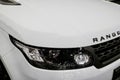 Front view headlight of a white Land Rover Range Rover Sport 2017. Car exterior details. Royalty Free Stock Photo