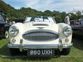 Front view of the headlights and bumper of a white Austin Healey 3000 Sports car at the Annual Hebden Bridge Vintage Weekend Vehic
