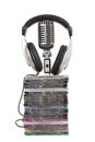 Front view of headphones , vintage microphone, dvd Royalty Free Stock Photo