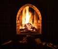 Hearth with burning firewood at night Royalty Free Stock Photo