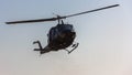 Front view of helicopter in flight. Fly on blue sky