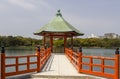 Front view of hexagonal, vermilion pagoda jutting out, Ohori Park (Fukuoka, Japan)