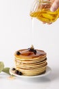 Front view honey poured pancake tower plate with blueberries. High quality and resolution beautiful photo concept Royalty Free Stock Photo