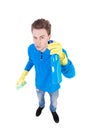 Front view of a houseowner in gloves with sponge and detergent. Royalty Free Stock Photo