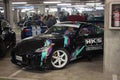 iconic Japanese racing car, the black Nissan 350Z tuned by HKS parked in a parking lot