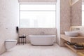 Front view of light modern bathroom interior design with tiles stone floor and walls, white bath and window with city view. 3D Royalty Free Stock Photo