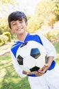 front view of little boy balloon holding balloon Royalty Free Stock Photo