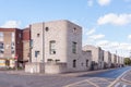 Front view of long row of modern terraced town houses in a residential street part of Barking development Royalty Free Stock Photo