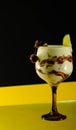 Front view of love cocktail on black and yellow background