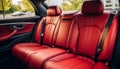 Front view of luxurious modern car interior with stylish red leather back passenger seats Royalty Free Stock Photo