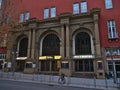 Front view of main entrance of cinema Metropol located in historic old building in downtown.