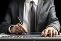 Front view of male graphic designer sitting at his office desk Royalty Free Stock Photo