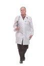 Front view of mature woman doctor walking with clipboard Royalty Free Stock Photo