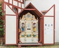 Front view of a mechanical street organ in Rudesheim, Germany, enclosed in a protective cabinet
