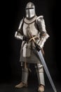 Front view of medieval crusader knight helmet, isolated on black background, created with generative AI