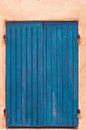 Closed, pair of, colorful, blue, wood, window shutters