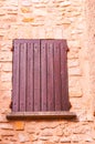 Closed, pair of, colorful, red, wood, window, shutters Royalty Free Stock Photo