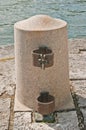 Granite anchoring post with metal couplings