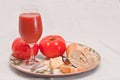 Plate with a ripe, local, freshly picked, beef steak tomatoes with a chuck of aged cheese, a section of freshly baked baguette Royalty Free Stock Photo