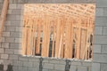 Window opening in cinder block wall, showing interior wall, studs