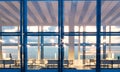 Front view meeting room modern skyscraper.Open space interior in evening time.Panoramic windows facade background Royalty Free Stock Photo