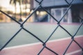 Front view from a metal grid of a sports court.