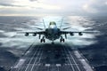 Front view of a military jet fighter landing on the deck of an aircraft carrier. Cloudy sky over the sea horizon. The Royalty Free Stock Photo