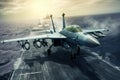 Front view of a military jet fighter taking off from the deck of an aircraft carrier. Cloudy sky over the sea horizon Royalty Free Stock Photo