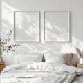 front view of a minimal cosy bedroom plain white wall with two empty white squared frame measuring 40cm high and 40cm wide