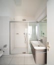 Front view modern bathroom with shower and sink Royalty Free Stock Photo