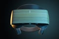 Front view on modern custom VR headset with wooden surface on abstract dark backdrop, virtual reality concept.