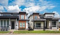 Modern homes. Real estate exterior of a new modern houses. Front view of modern designed concrete residential house Royalty Free Stock Photo