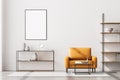 Front view of modern living room interior with one empty poster on white wall, mock up. Furnished by yellow armchair, coffee table Royalty Free Stock Photo