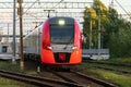 Front view of modern intercity high speed train on railway platform on railroad. Royalty Free Stock Photo