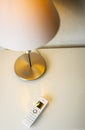 Cordless phone next to a desk lamp - view from above Royalty Free Stock Photo