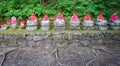 Front view of moss covered statues of Jizo in Nikko Royalty Free Stock Photo